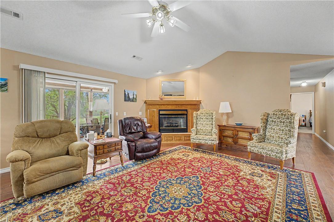 Image 3: Living area featuring hardwood / wood-style floors