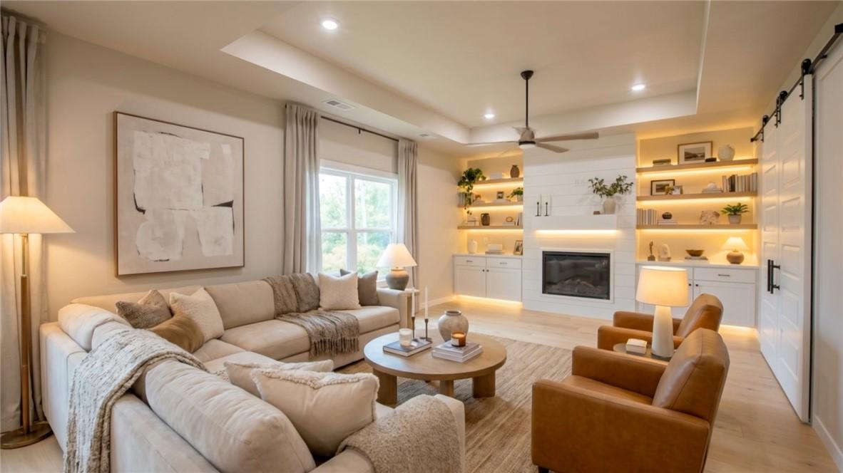 Image 3: Spacious living room with gas fireplace.  Furnitur