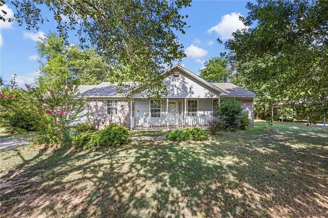Image 1: Single-story residence featuring a combination of