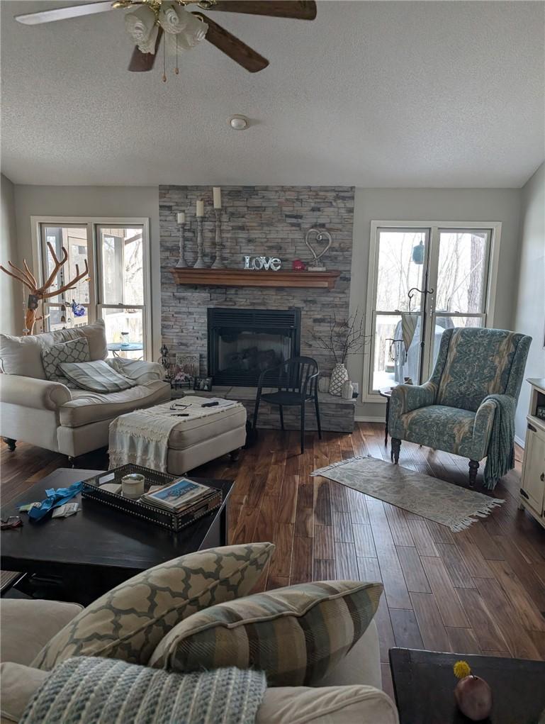 Image 2: Living area featuring wood-finish flooring, a stac
