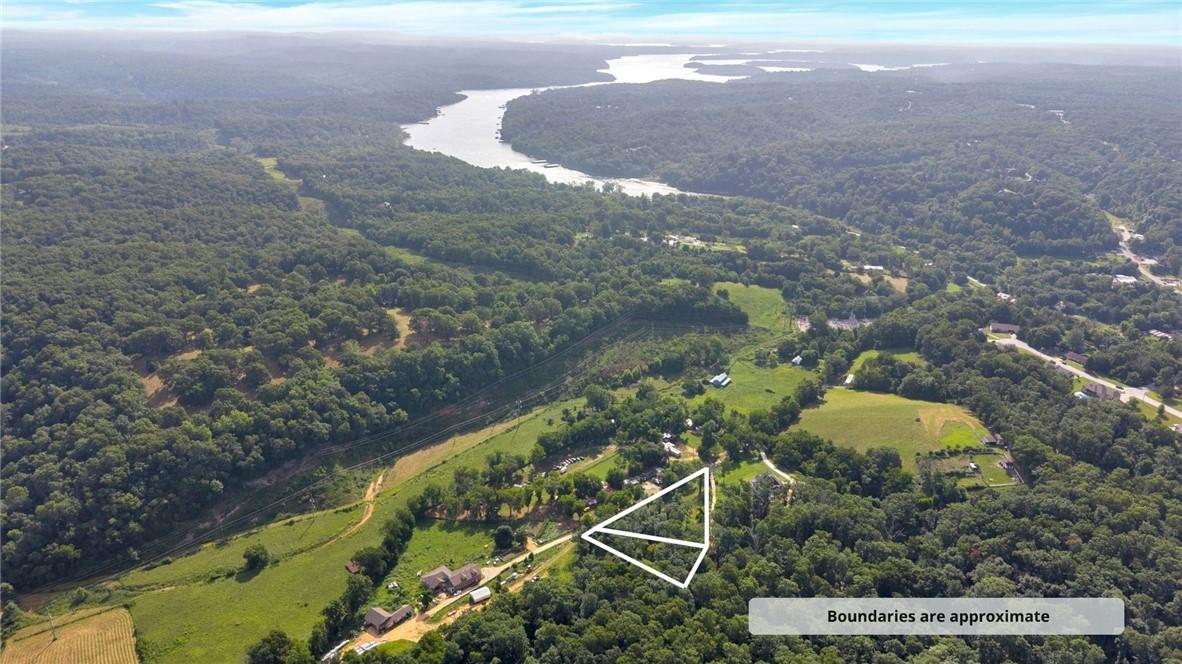 Image 1: Aerial perspective showcasing expansive wooded ter