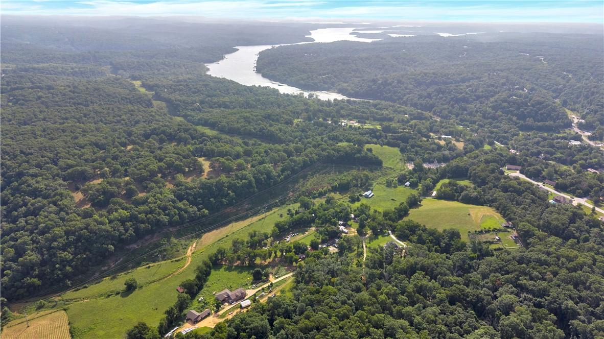 Image 2: Expansive wooded landscape featuring a winding riv