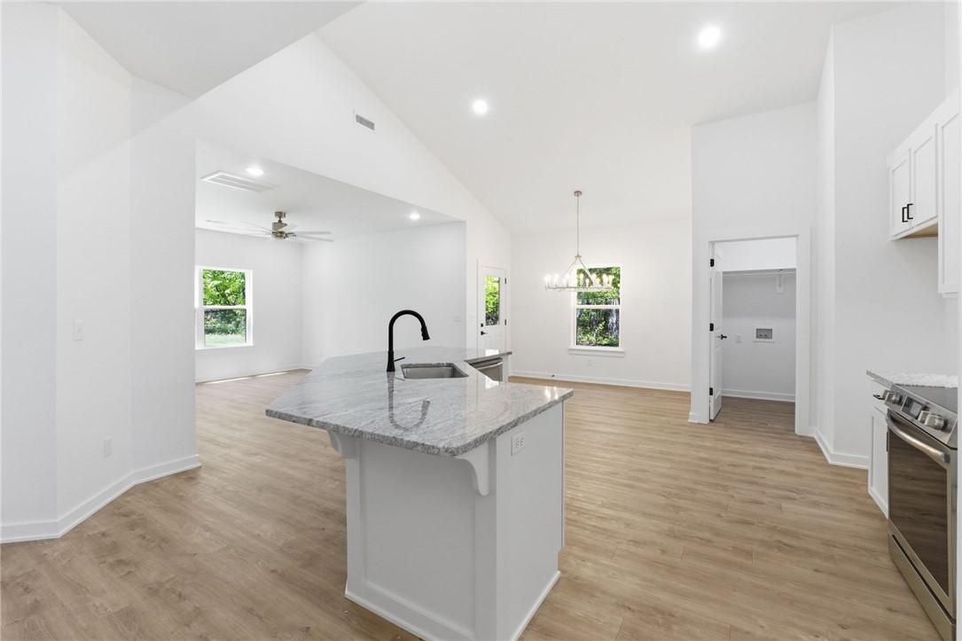 Image 3: Kitchen island featuring a single-basin sink, blac