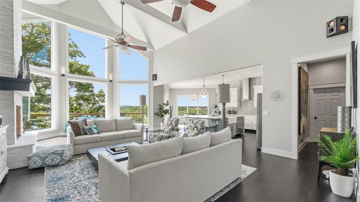 Image 1: Soaring vaulted ceilings with exposed beams and ce