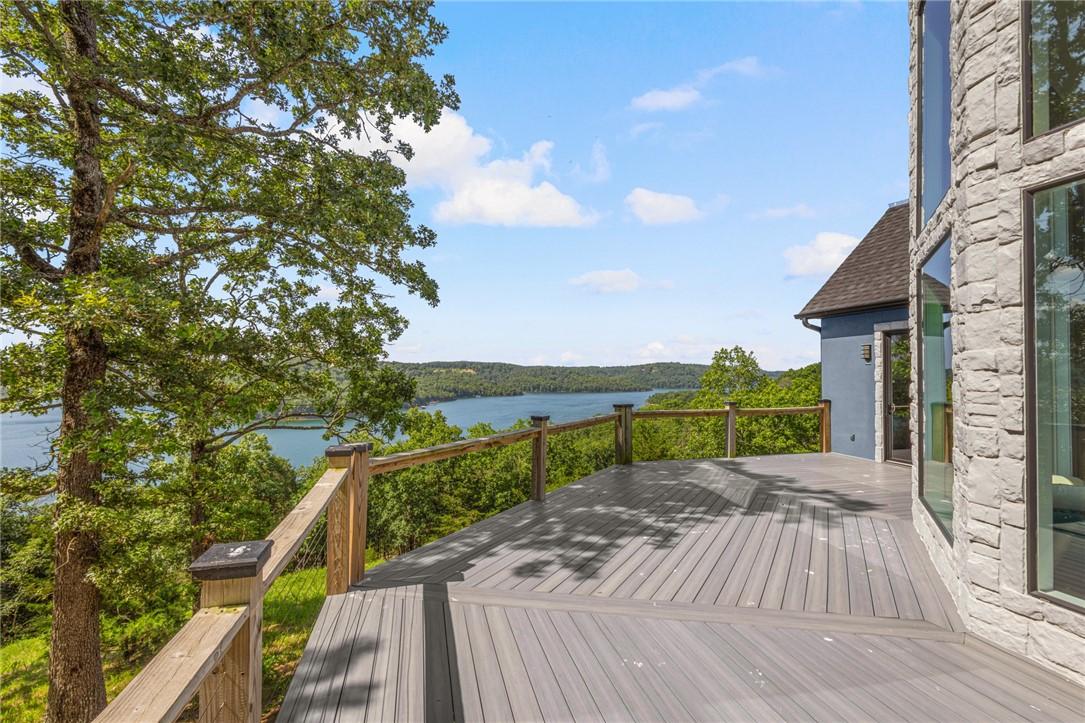 Image 3: Wooden terrace with a water view