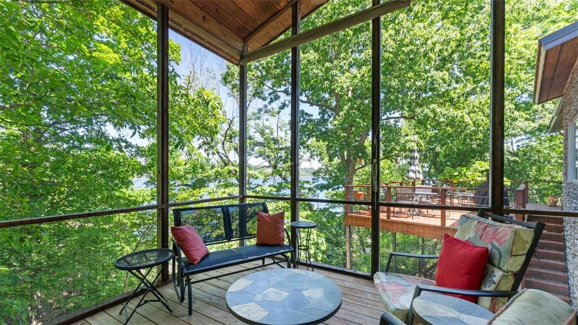 Image 4: Screened porch with wood-finish flooring and a woo