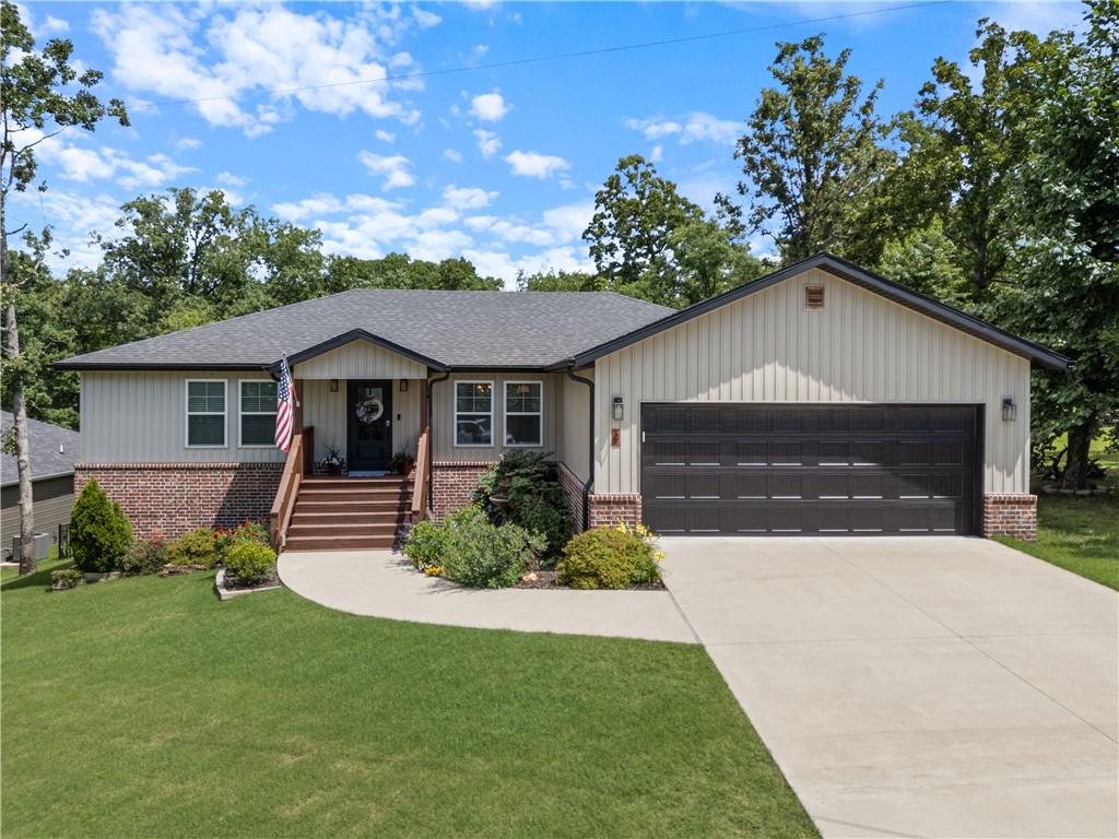 Image 2: Exterior featuring brick accents, board and batten