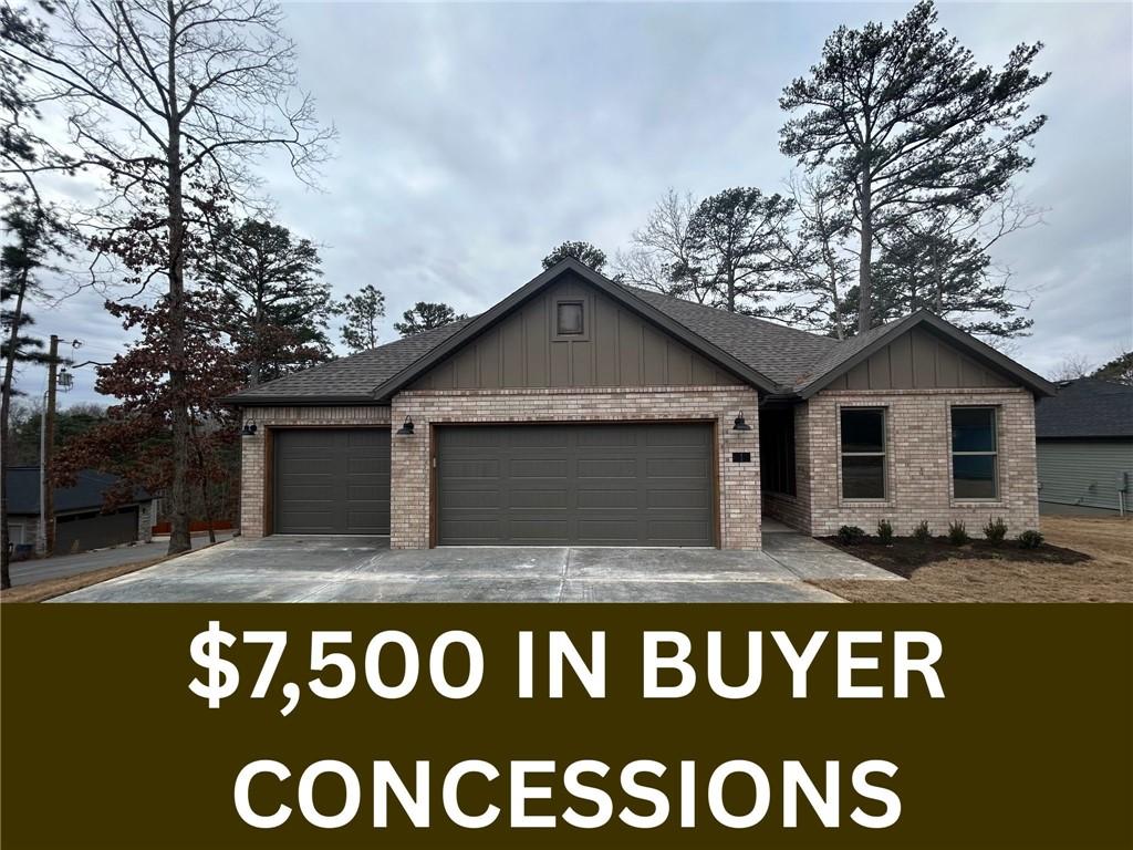 Image 1: View of front of home with board and batten siding