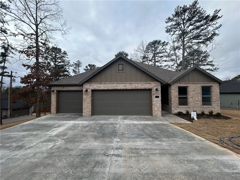 Image 3: Ranch-style home with board and batten siding, con