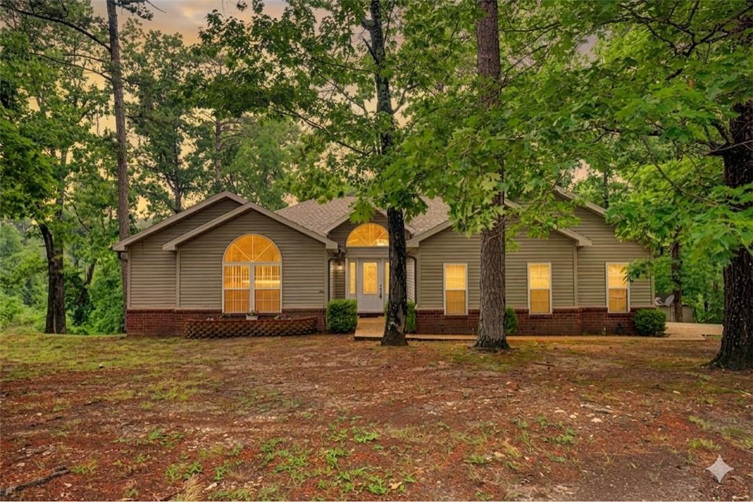 Image 2: Ranch-style residence featuring a prominent arched