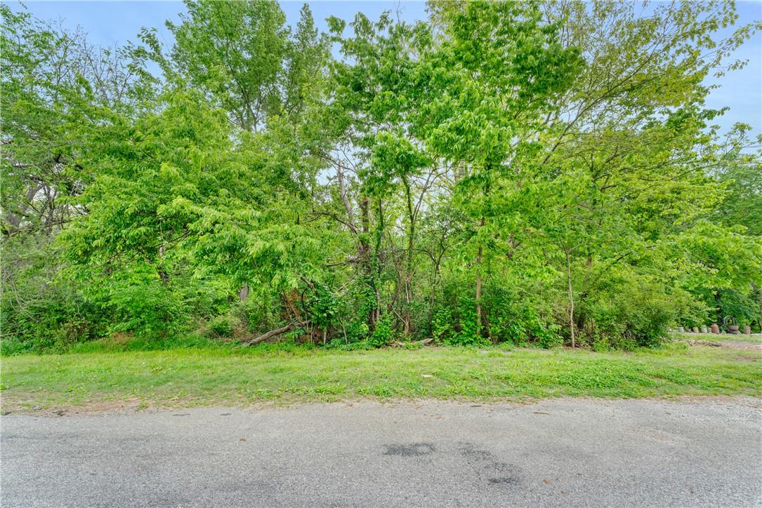 Image 4: Tree-lined property featuring mature foliage and a