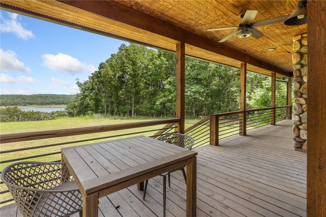 Image 3: Expansive covered deck featuring wood plank floori