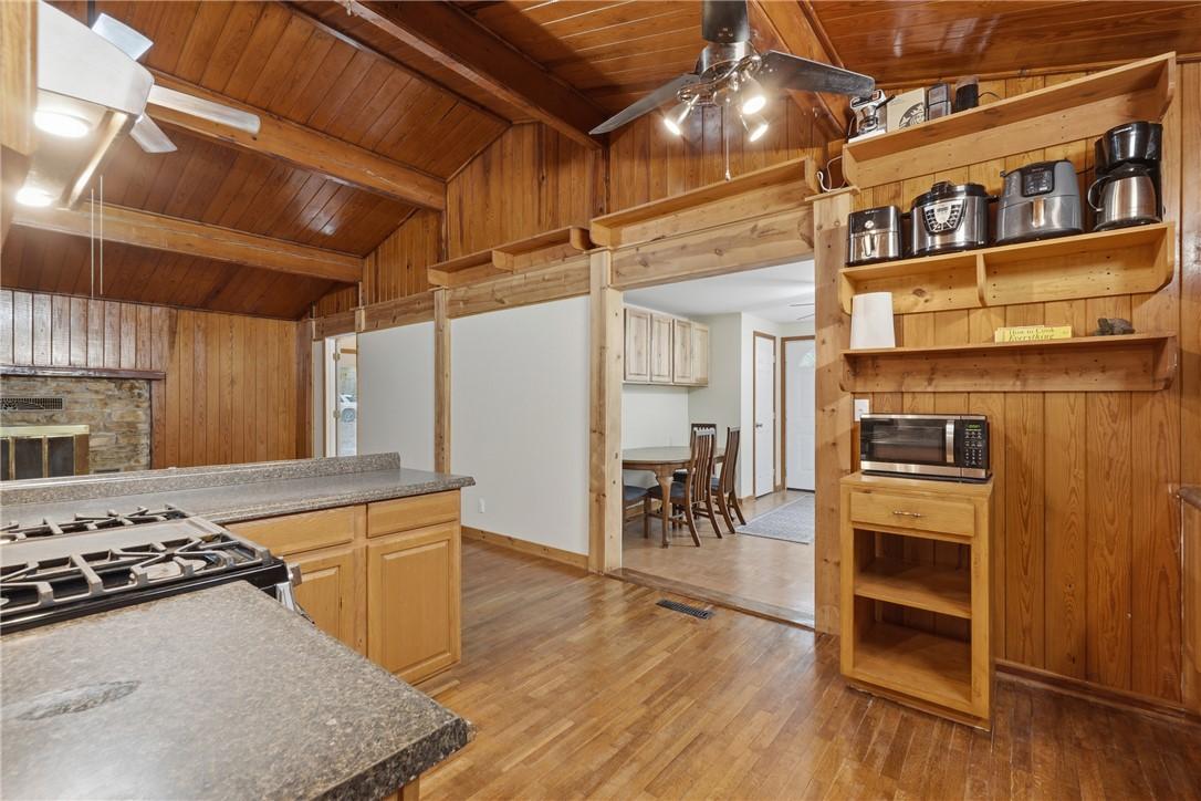 Image 4: Kitchen just off Dining room with ceiling fan, woo