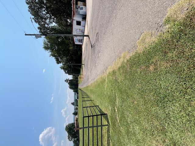 Image 2: Looking south from highway to east gate