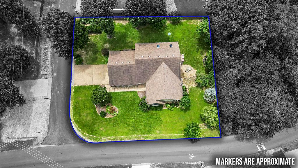 Image 2: Home sits on a corner lot with a large, beautiful