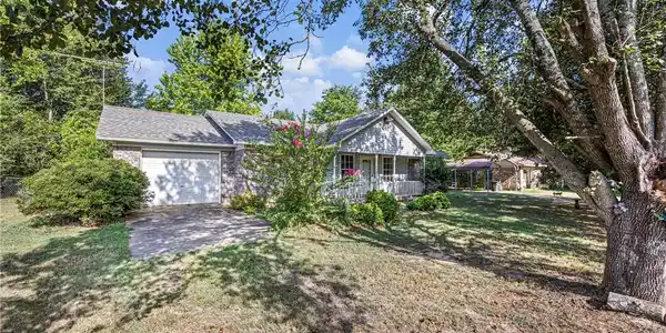 Image 2: Ranch-style residence featuring a brick facade, at