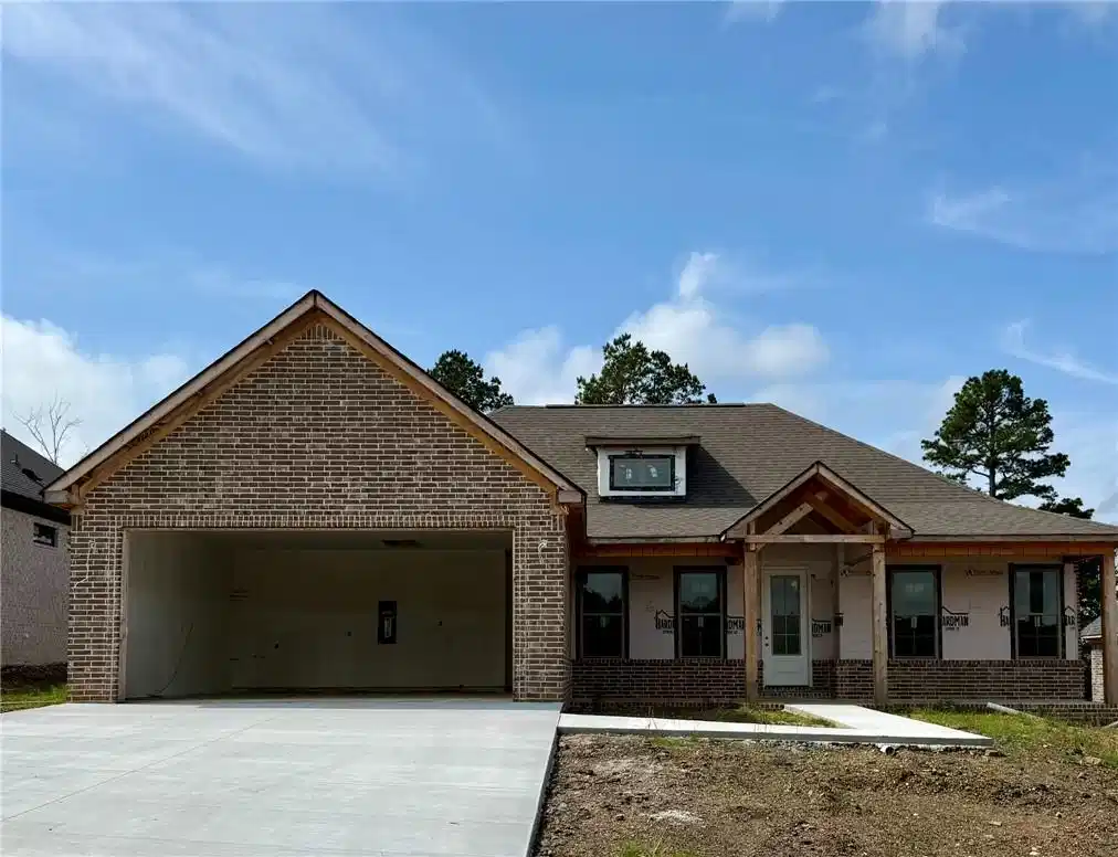 Image 1: Brick exterior with wood-frame gables
