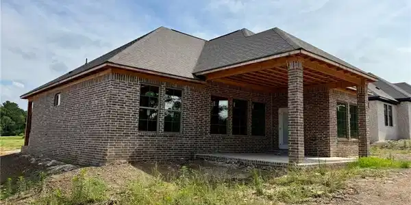 Image 4: Brick exterior featuring a covered patio with expo