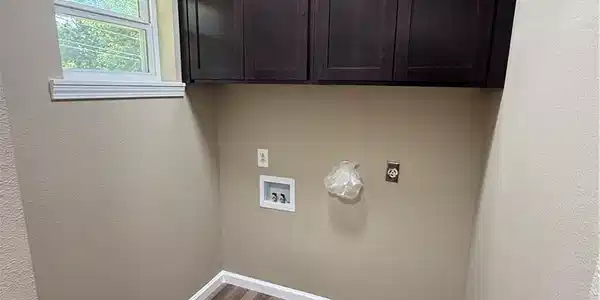 Image 4: Utility room featuring wood-finish flooring, overh
