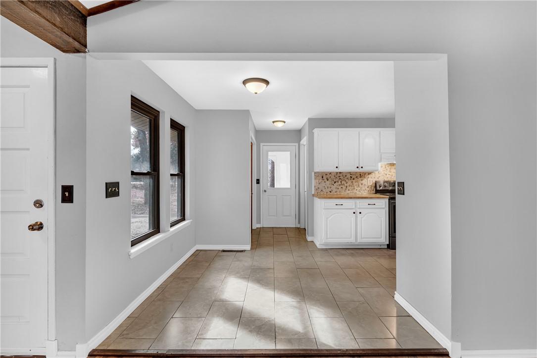 Image 4: Foyer entrance with healthy amount of natural ligh