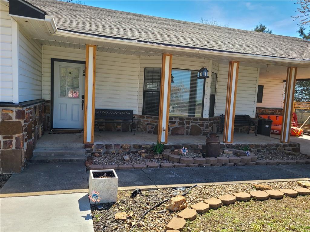 Image 2: Doorway to property featuring covered porch, a shi