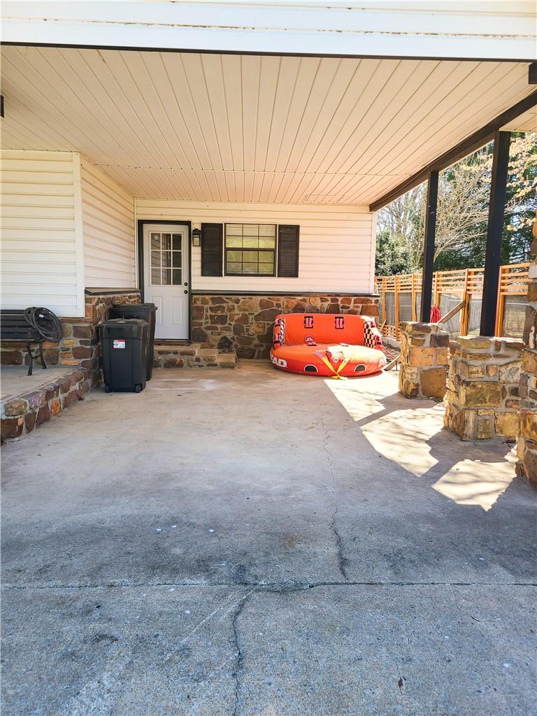 Image 3: View of patio with a carport