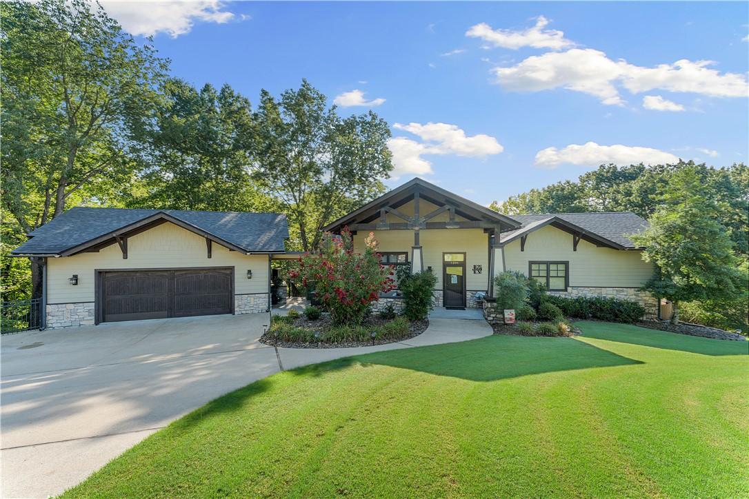 Image 1: Craftsman inspired home with stone siding, an atta