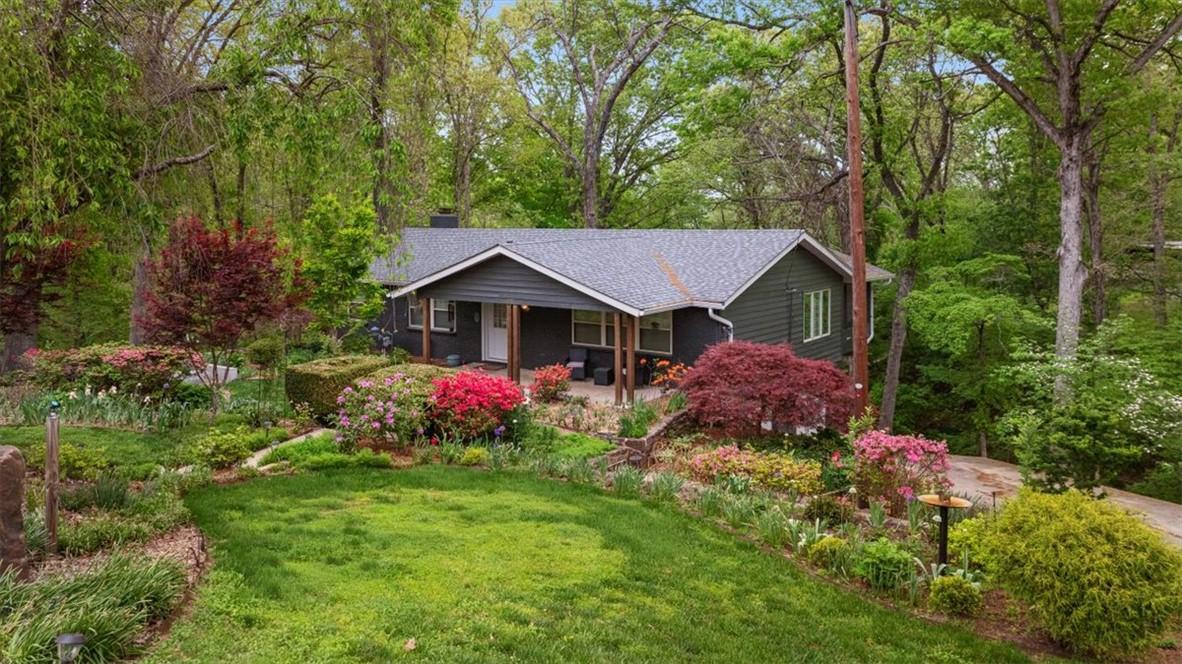 Image 2: The property features a dark-colored exterior with