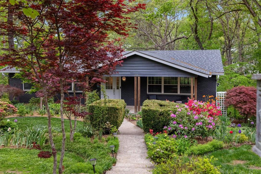 Image 4: The property features a charming exterior with dar