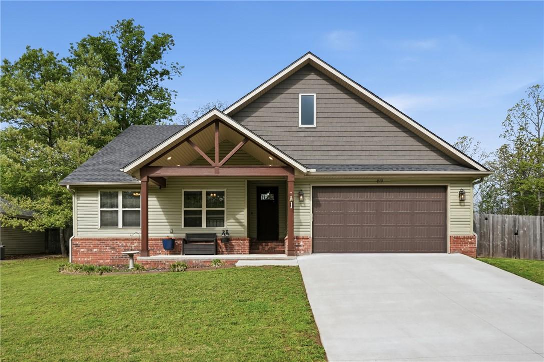 Image 3: This property features a well-maintained front law