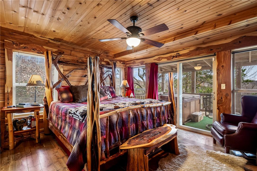 Image 2: Bedroom with hardwood / wood-style floors, wood ce