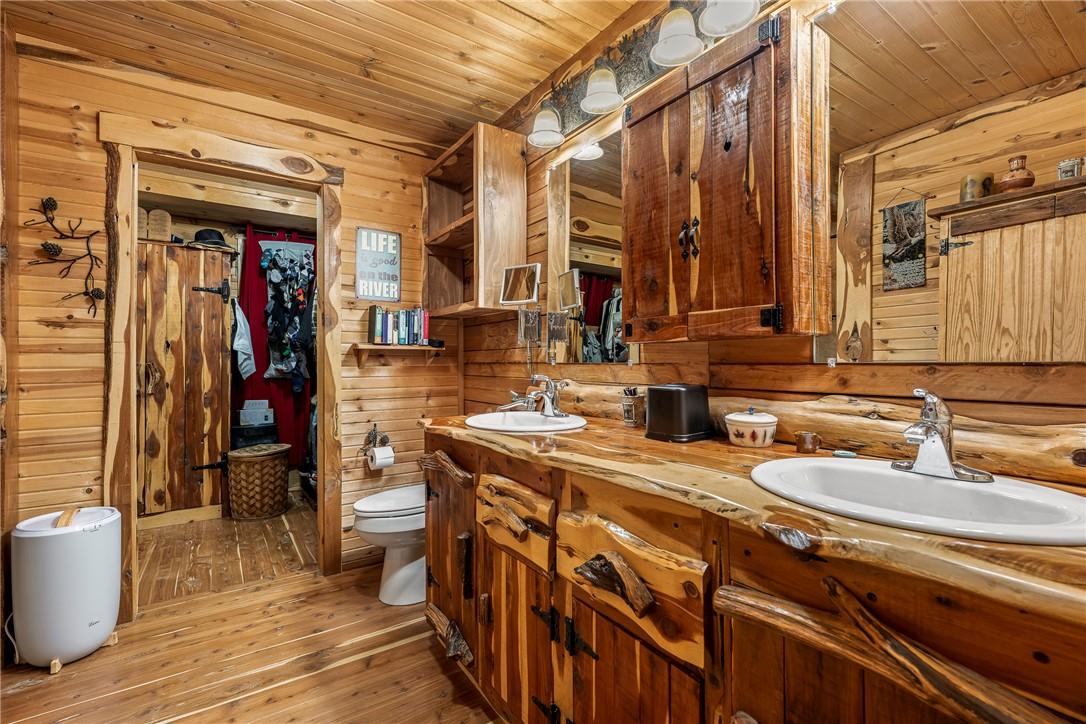 Image 4: Bathroom with light wood-type flooring, double van