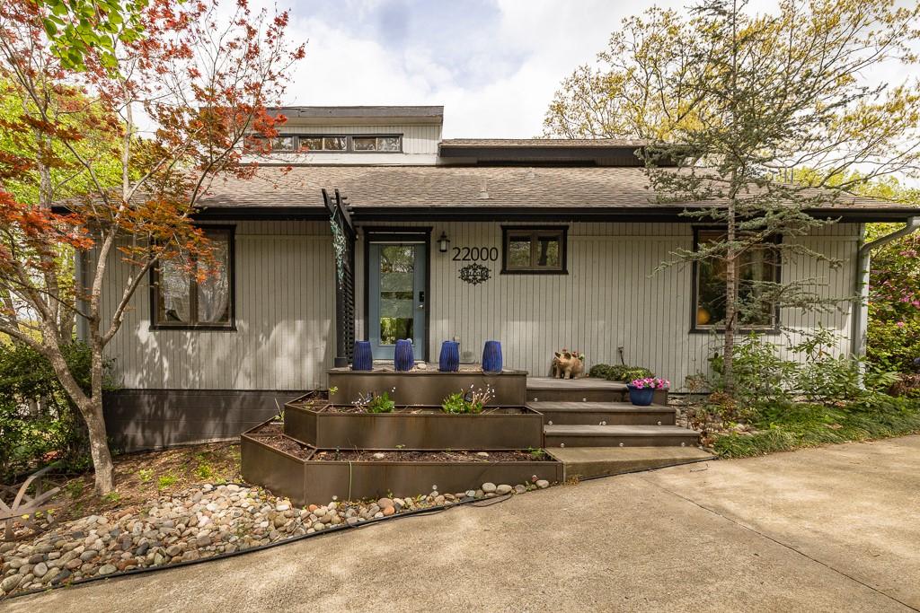 Image 2: View of front of property with roof with shingles