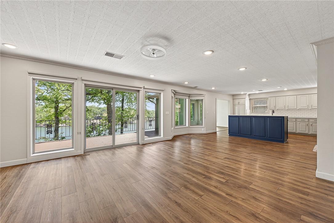 Image 4: Spacious living area featuring large sliding glass