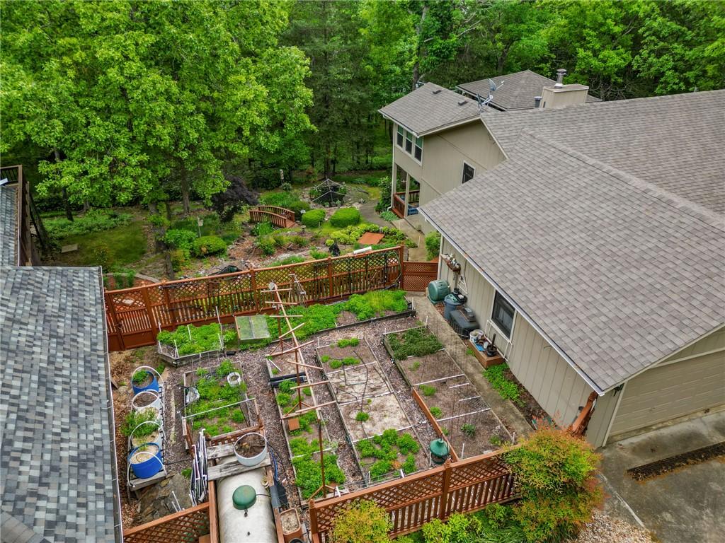Image 4: Expansive garden area featuring multiple raised be