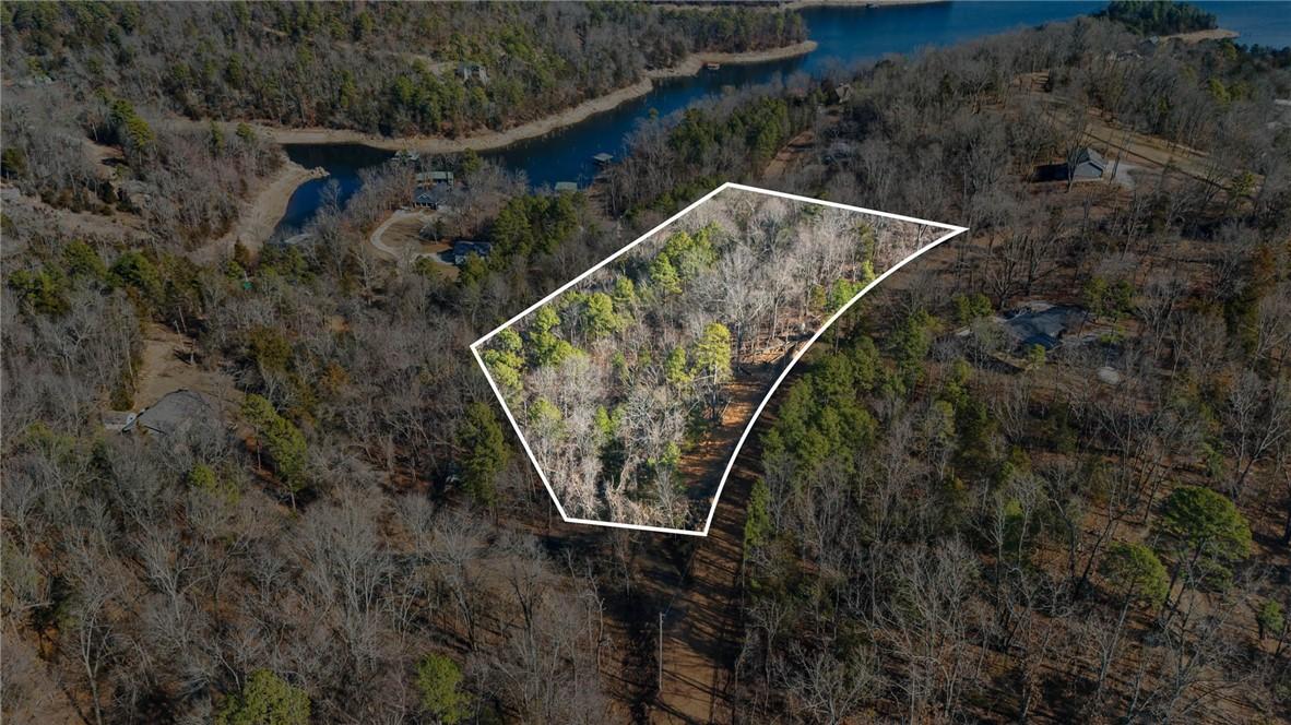 Image 2: Aerial view of property and surrounding area with