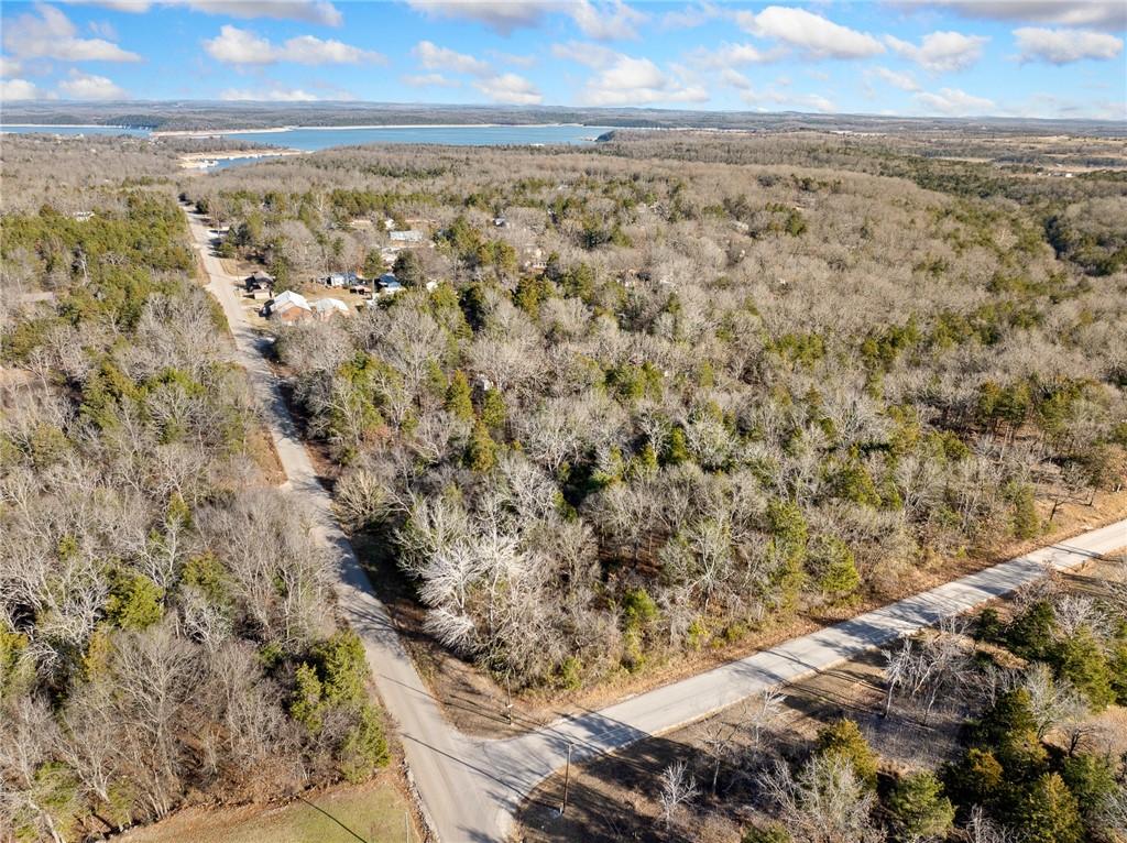 Image 3: View of property location featuring a forest and a