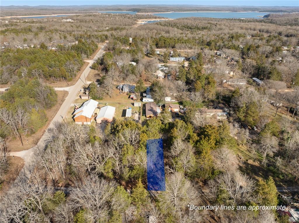 Image 3: Aerial view of property and surrounding area with