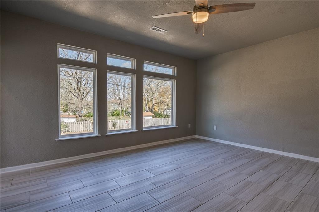 Image 3: Unfurnished room with ceiling fan, wood tiled floo