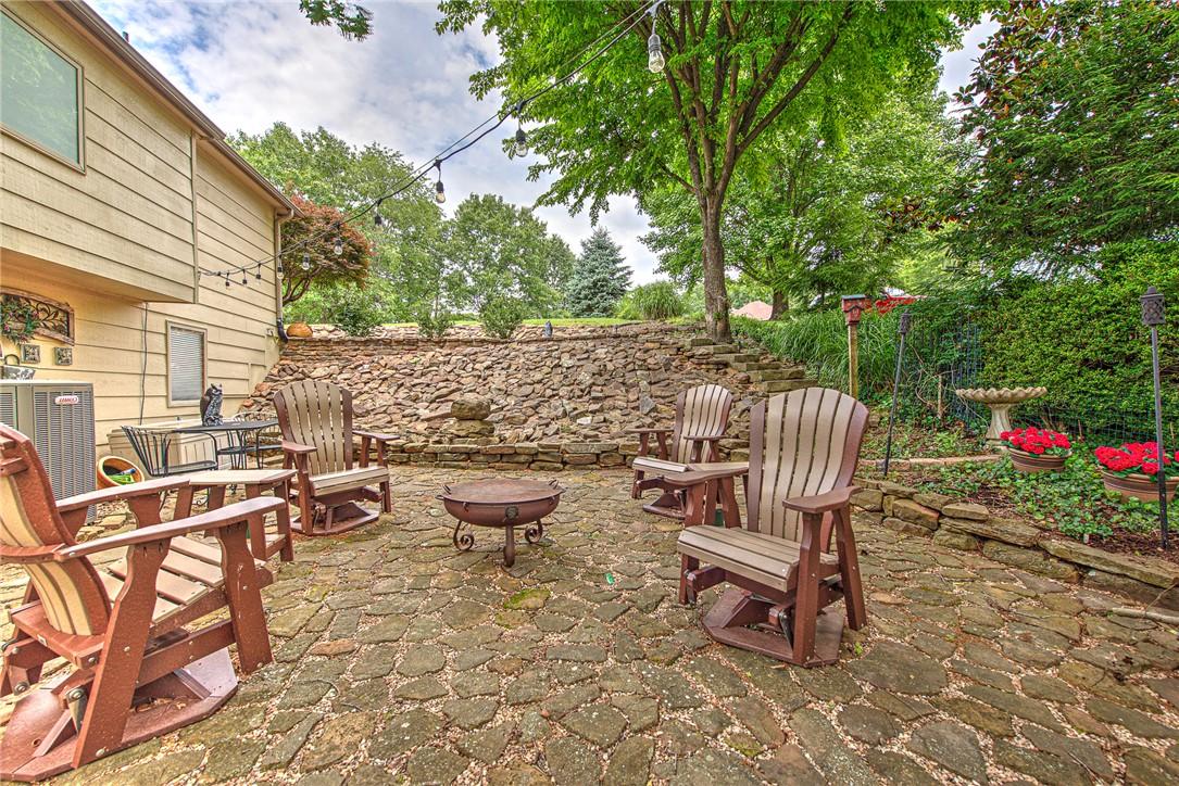 Image 3: East side flagstone retaining wall, patio, fountai