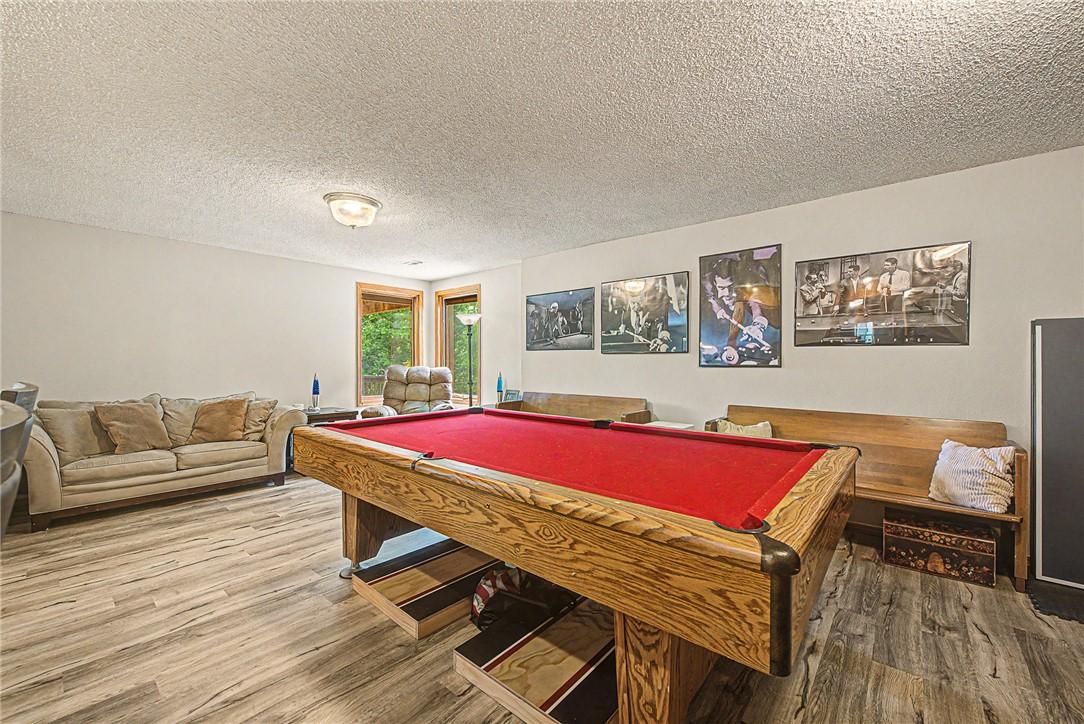 Image 4: Game room (lower level) with pool table and rack (