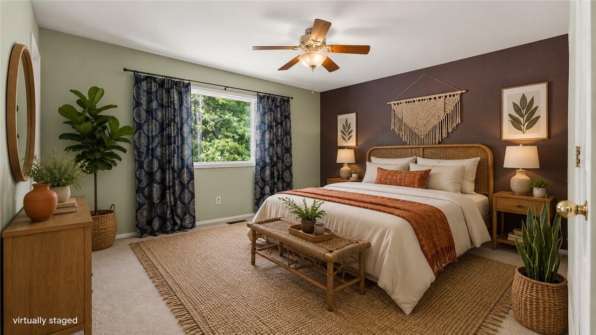 Image 4: Spacious bedroom with light-toned carpeting and a