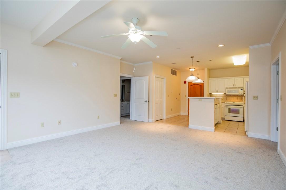 Image 2: Unfurnished living room with ceiling fan, light ca