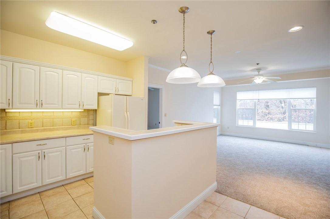 Image 4: Kitchen featuring pendant lighting, tasteful backs