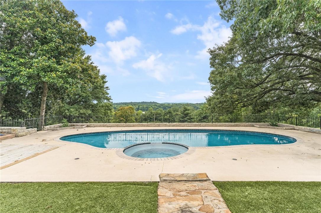 Image 3: View from kitchen window overlooking pool and Lake