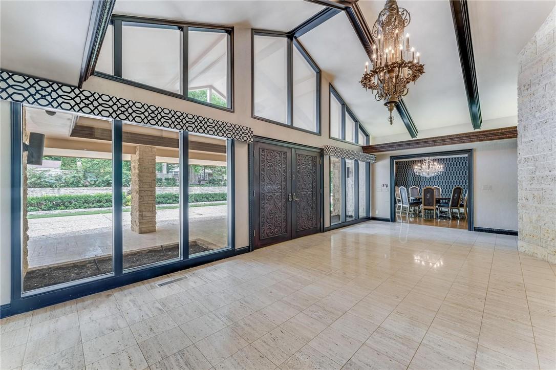 Image 4: Front entry with original antique chandelier