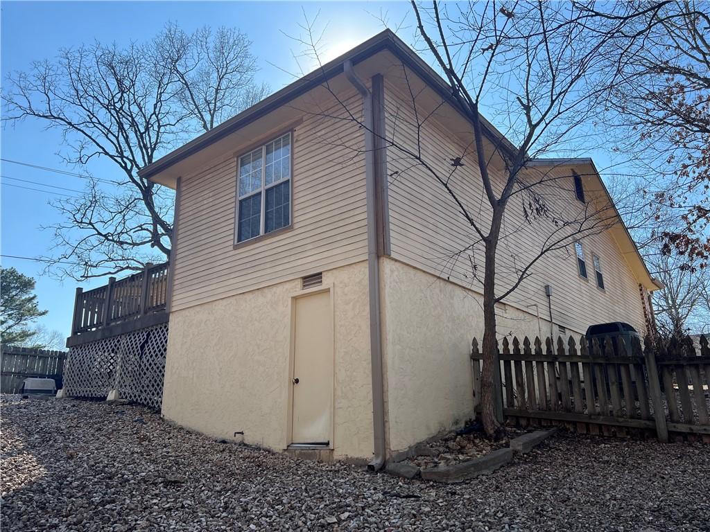 Image 4: Rear view featuring composite deck, crawlspace acc