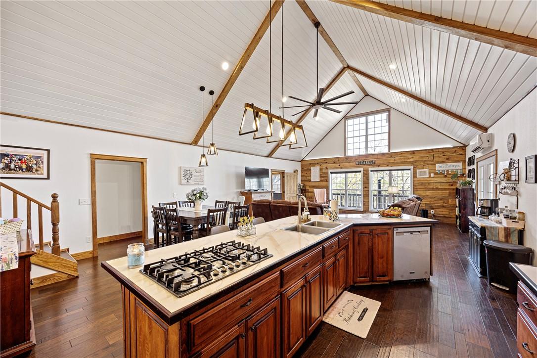 Image 3: Kitchen with open floor plan, a ceiling fan, stain