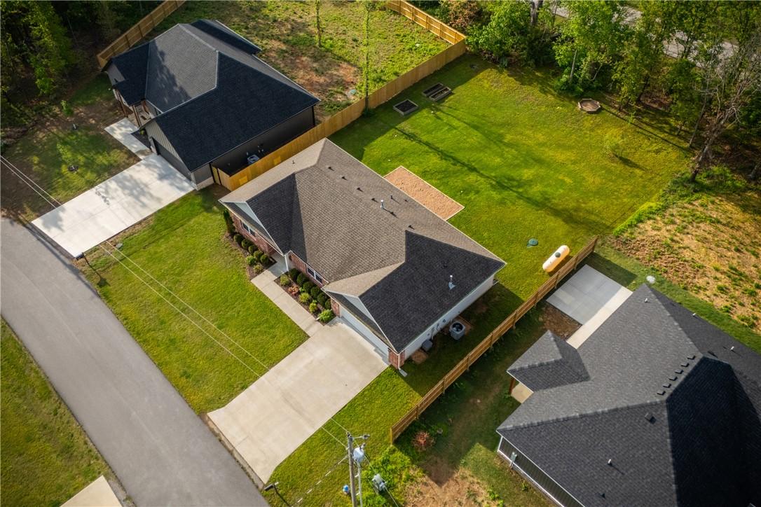 Image 3: Aerial view showcasing a residential property with