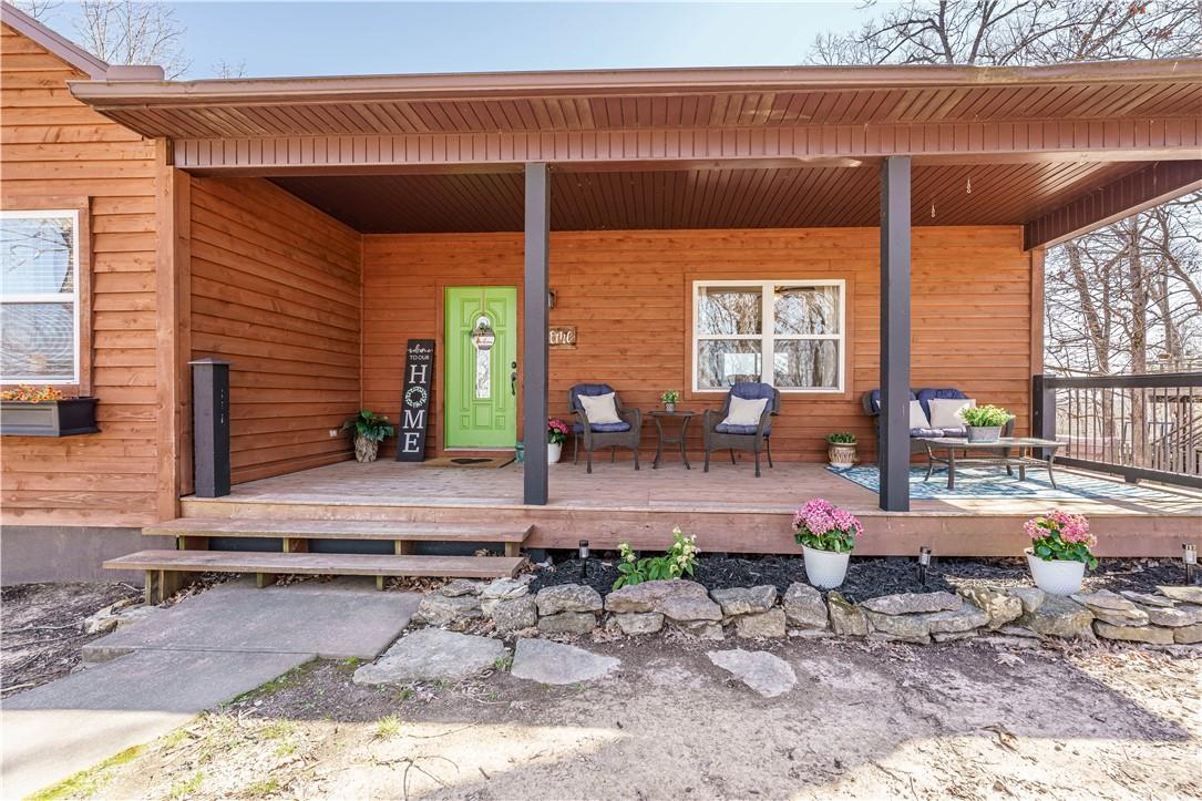 Image 4: Front porch has a winter view of the lake.